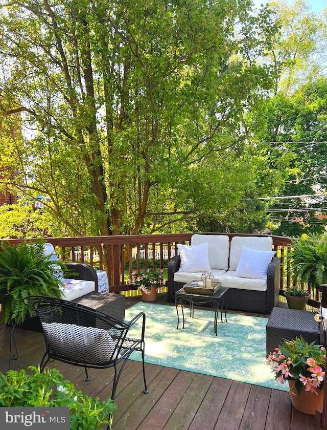 wooden deck with an outdoor hangout area