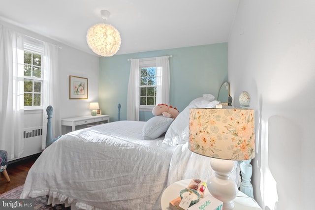 110 Murdock Rd, Baltimore, MD 21212 - bedroom with multiple windows, wood finished floors, and radiator