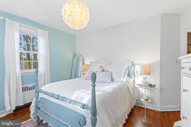 110 Murdock Rd, Baltimore, MD 21212 - bedroom with wood finished floors, radiator, and baseboards