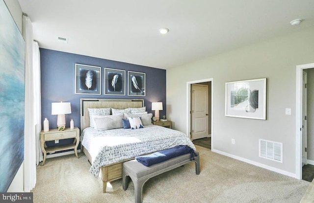 bedroom with baseboards, carpet flooring, and visible vents