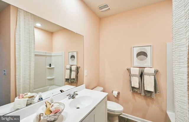 bathroom featuring visible vents, vanity, toilet, baseboards, and shower / tub combo
