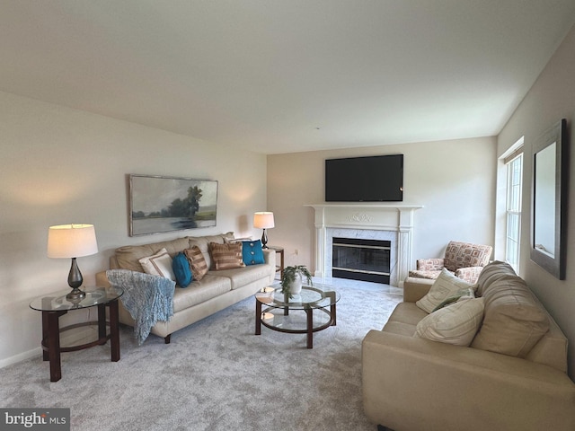 carpeted living area featuring a fireplace