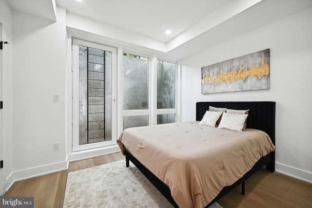 1372 Bryant St NE Unit 201, Washington, DC 20018 - bedroom featuring baseboards, recessed lighting, and wood finished floors