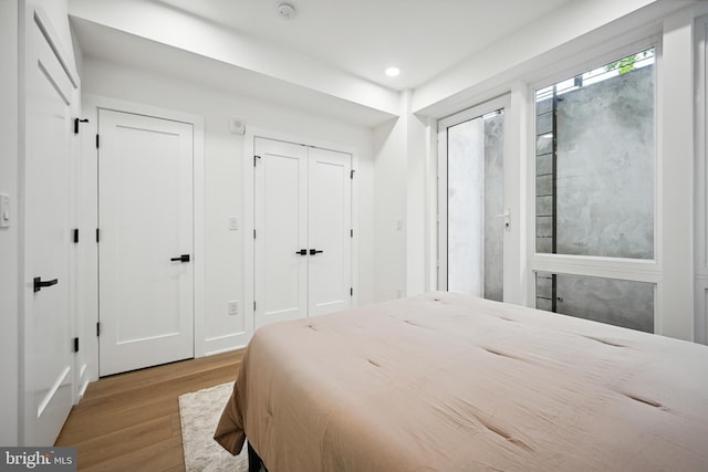 1372 Bryant St NE Unit 201, Washington, DC 20018 - bedroom featuring recessed lighting, wood finished floors, and two closets