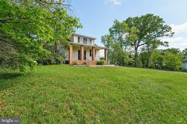 3216 E Joppa Rd, Baltimore, MD 21234 - view of front facade with a porch, brick siding, and a front lawn
