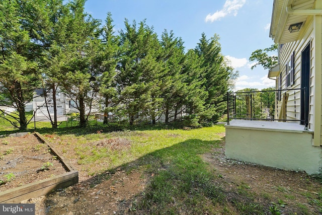 3216 E Joppa Rd, Baltimore, MD 21234 - view of yard featuring a vegetable garden and fence