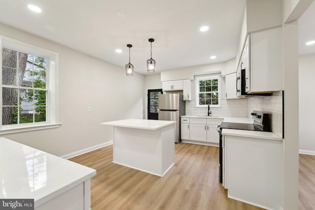 3216 E Joppa Rd, Baltimore, MD 21234 - kitchen featuring stainless steel appliances, backsplash, light wood-style flooring, white cabinets, and recessed lighting