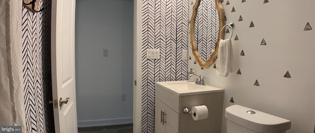 half bath with vanity and toilet