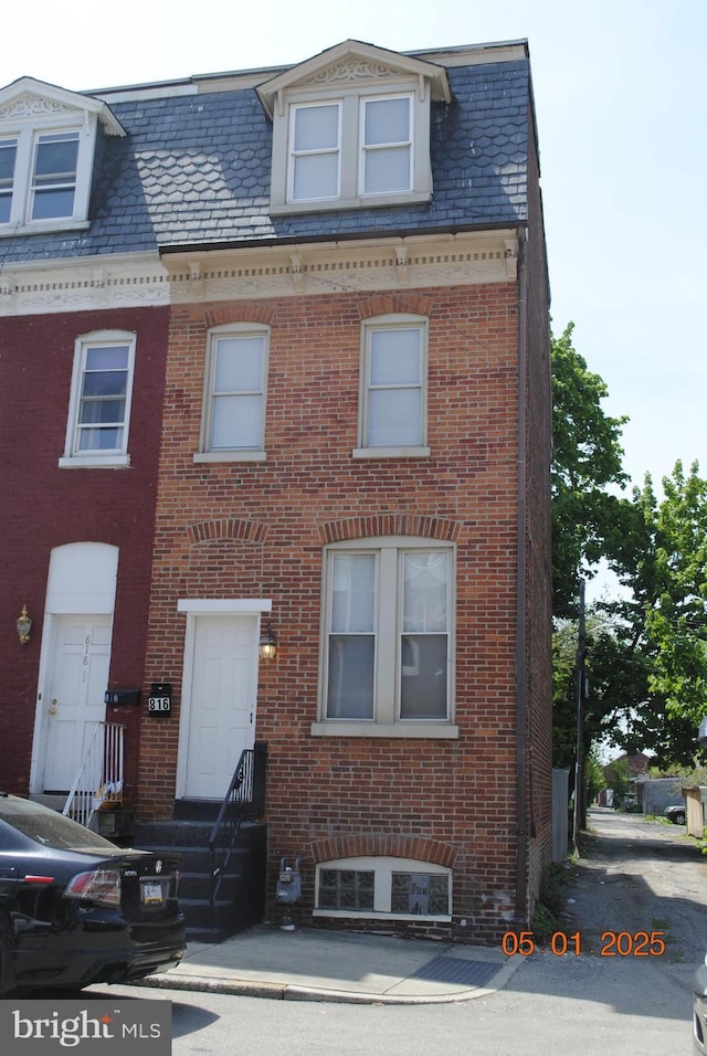 816 S Beaver St, York, PA 17403 - view of front of property featuring brick siding, mansard roof, and a high end roof