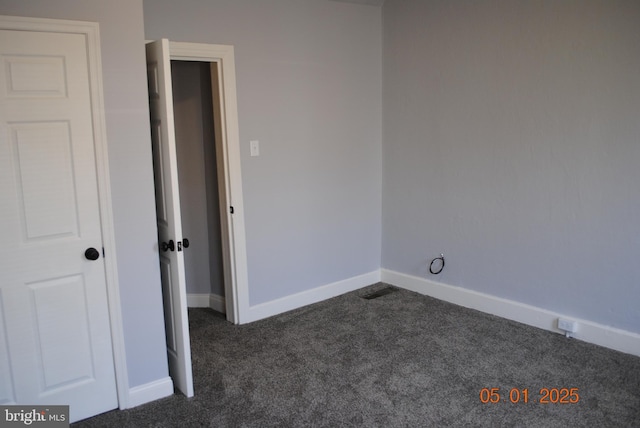 816 S Beaver St, York, PA 17403 - unfurnished bedroom featuring dark carpet and baseboards
