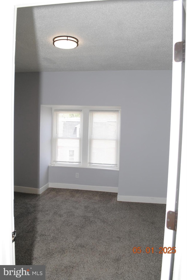 816 S Beaver St, York, PA 17403 - spare room featuring carpet, a textured ceiling, and baseboards