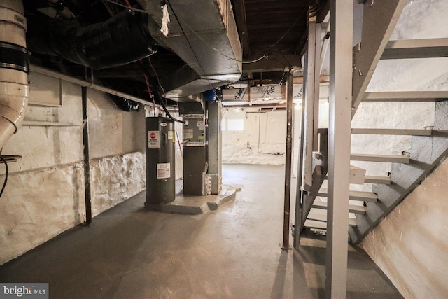 816 S Beaver St, York, PA 17403 - unfinished basement with water heater, heating unit, and stairway