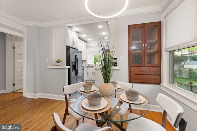 2610 Hamlin St NE, Washington, DC 20018 - dining room featuring crown molding, light wood-style floors, baseboards, and recessed lighting