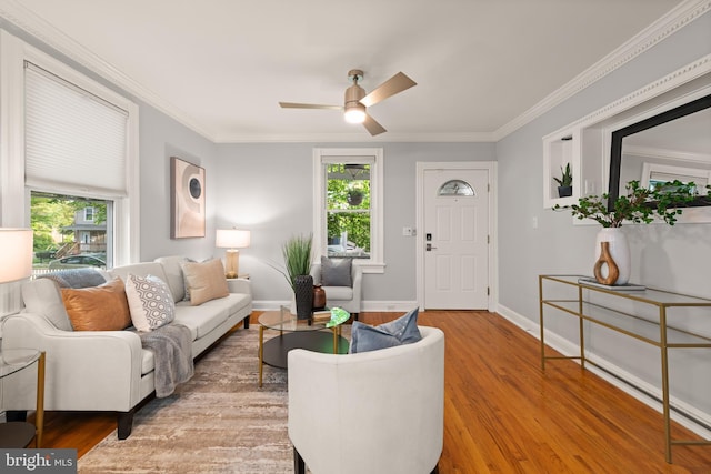 2610 Hamlin St NE, Washington, DC 20018 - living area with healthy amount of natural light, ceiling fan, wood finished floors, ornamental molding, and baseboards