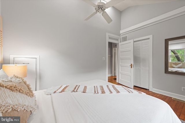 2610 Hamlin St NE, Washington, DC 20018 - bedroom with a closet, wood finished floors, high vaulted ceiling, baseboards, and ceiling fan