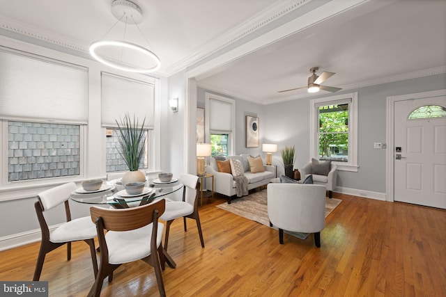 2610 Hamlin St NE, Washington, DC 20018 - living room featuring light wood-type flooring, crown molding, baseboards, and ceiling fan
