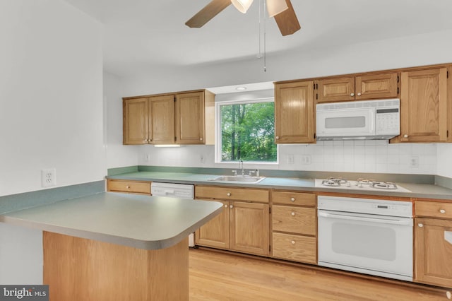 1529 Red Oak Dr, Silver Spring, MD 20910 - kitchen featuring white appliances, a sink, backsplash, a peninsula, and light wood finished floors