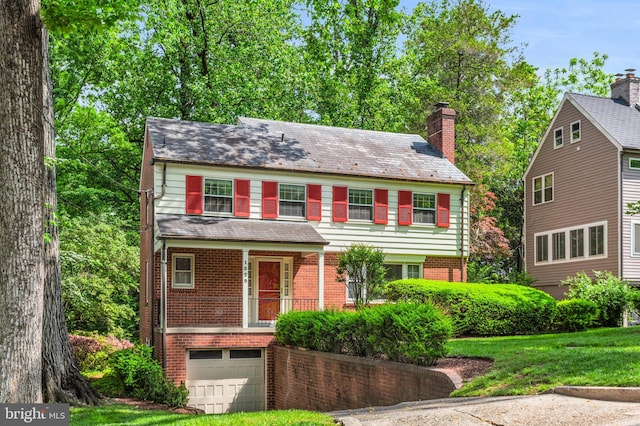 1529 Red Oak Dr, Silver Spring, MD 20910 - view of front of property with an attached garage, brick siding, a chimney, and a front yard