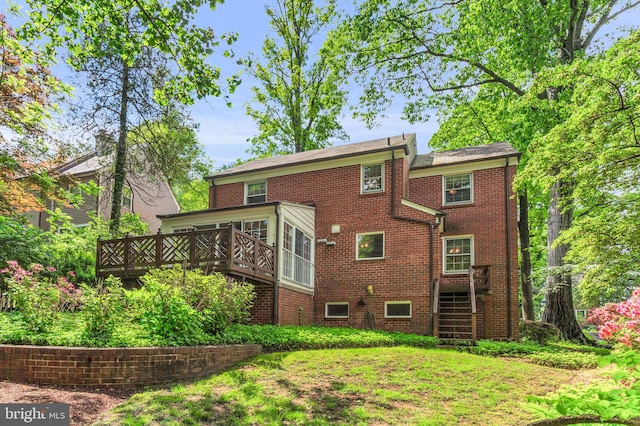 1529 Red Oak Dr, Silver Spring, MD 20910 - back of house featuring a wooden deck, brick siding, and a sunroom