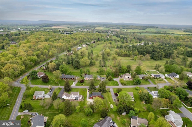 drone / aerial view featuring a forest view