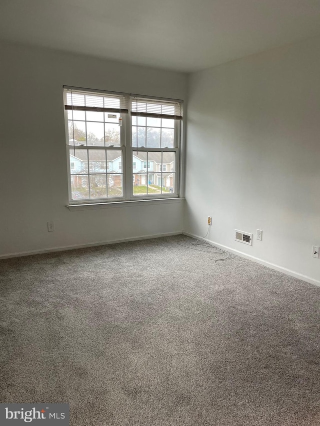216 Highland Blvd Unit 77, New Castle, DE 19720 - empty room featuring carpet and baseboards