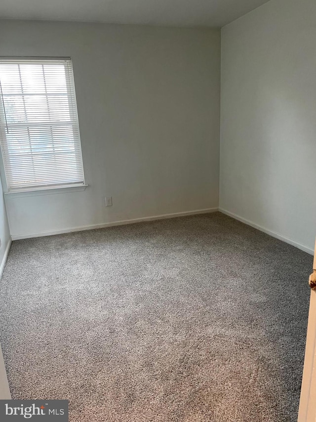 216 Highland Blvd Unit 77, New Castle, DE 19720 - carpeted spare room with baseboards