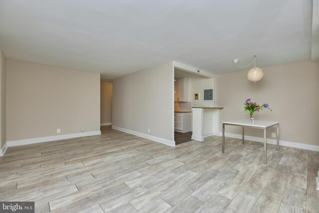 2030 N Adams St N Unit 507, Arlington, VA 22201 - living area featuring light wood-type flooring, electric panel, and baseboards