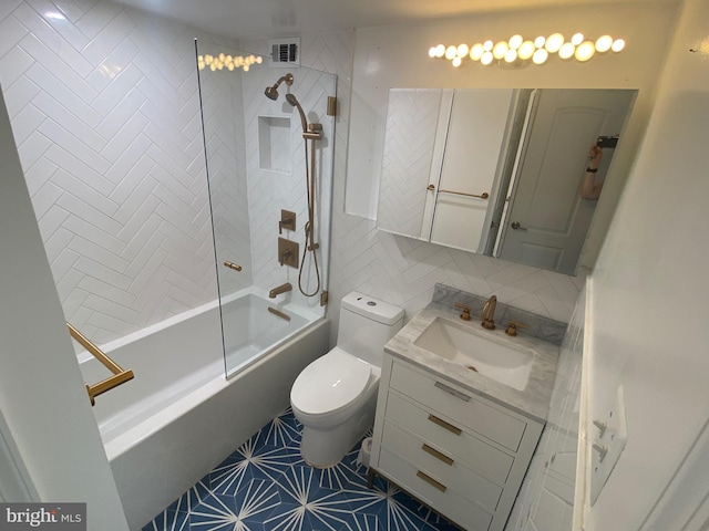 bathroom featuring washtub / shower combination, vanity, toilet, tile patterned floors, and visible vents