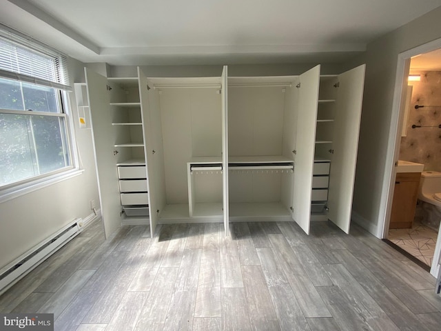 closet with a baseboard radiator