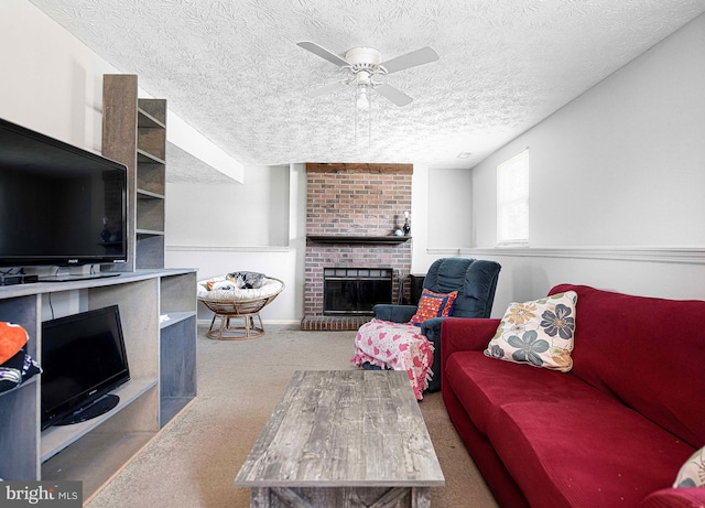 702 Rainbow Ct, Edgewood, MD 21040 - living room with carpet floors, a ceiling fan, a brick fireplace, and a textured ceiling