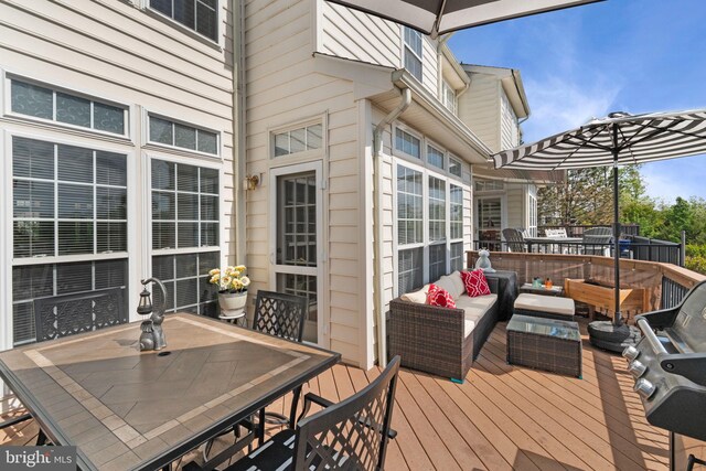 wooden deck featuring outdoor dining space and an outdoor living space