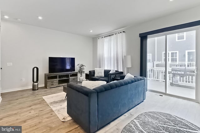 1701 Beech Leaf St, Dumfries, VA 22026 - living room featuring light wood-style flooring, healthy amount of natural light, recessed lighting, and baseboards