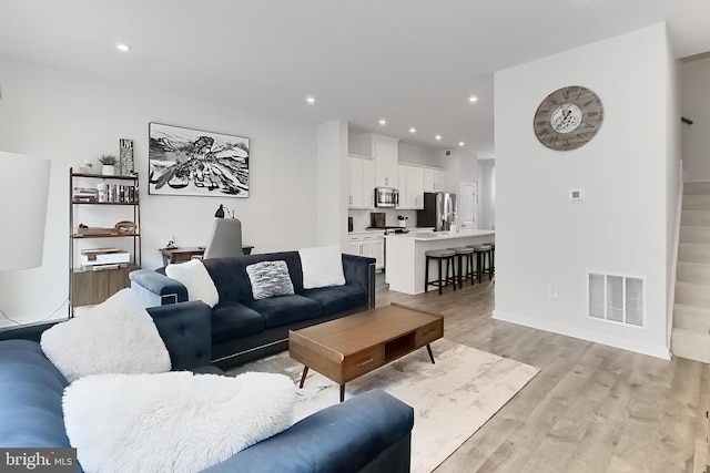 1701 Beech Leaf St, Dumfries, VA 22026 - living area with light wood finished floors and recessed lighting