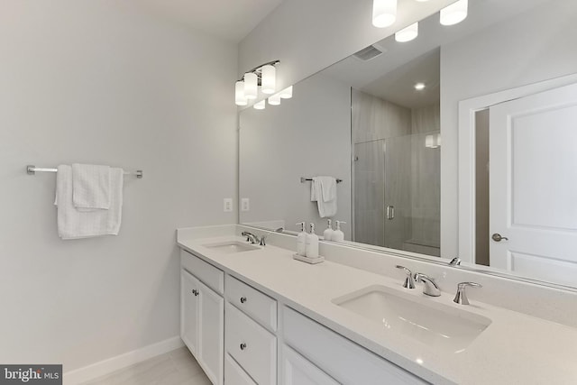 1701 Beech Leaf St, Dumfries, VA 22026 - full bath with a stall shower, double vanity, and baseboards