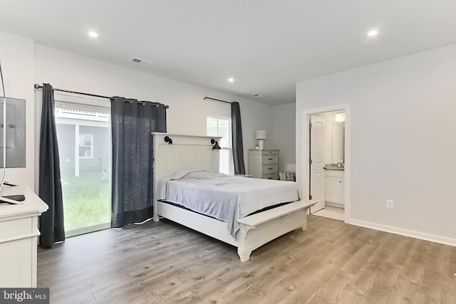 1701 Beech Leaf St, Dumfries, VA 22026 - bedroom with light wood finished floors, multiple windows, recessed lighting, connected bathroom, and baseboards
