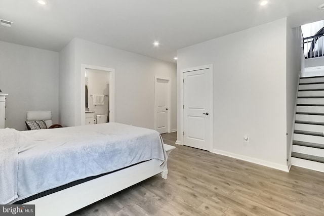 1701 Beech Leaf St, Dumfries, VA 22026 - bedroom featuring light wood-style flooring, recessed lighting, baseboards, and connected bathroom