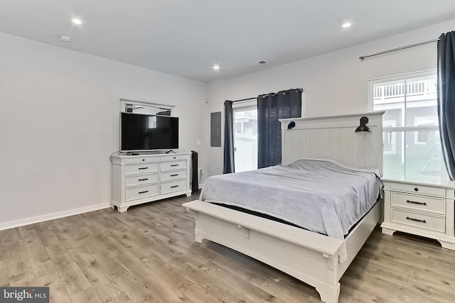 1701 Beech Leaf St, Dumfries, VA 22026 - bedroom featuring light wood-style floors, multiple windows, baseboards, recessed lighting, and electric panel