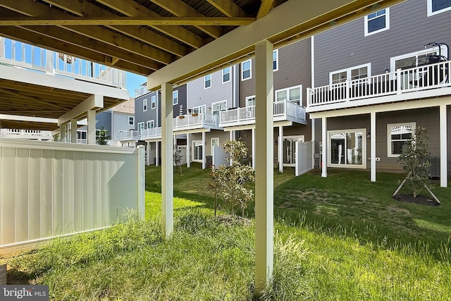 1701 Beech Leaf St, Dumfries, VA 22026 - rear view of property with a lawn and a residential view
