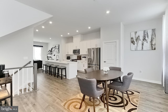 1701 Beech Leaf St, Dumfries, VA 22026 - dining area featuring light wood-style flooring, recessed lighting, and baseboards