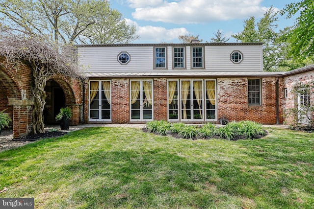 33 Rosedale Rd, Princeton, NJ 08540 - rear view of house with brick siding, a chimney, a lawn, and a standing seam roof