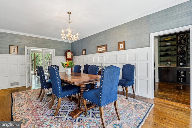 33 Rosedale Rd, Princeton, NJ 08540 - dining space with hardwood / wood-style floors, visible vents, a chandelier, wainscoting, and wallpapered walls
