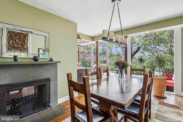 33 Rosedale Rd, Princeton, NJ 08540 - dining area featuring a multi sided fireplace, wood finished floors, and baseboards