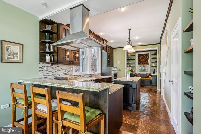 33 Rosedale Rd, Princeton, NJ 08540 - kitchen with a peninsula, island range hood, baseboards, decorative backsplash, and a kitchen island