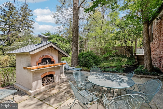 33 Rosedale Rd, Princeton, NJ 08540 - view of patio featuring outdoor dining space, an outdoor fireplace, and fence