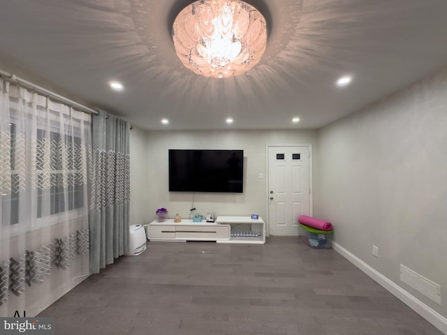 living room with baseboards, recessed lighting, wood finished floors, and visible vents