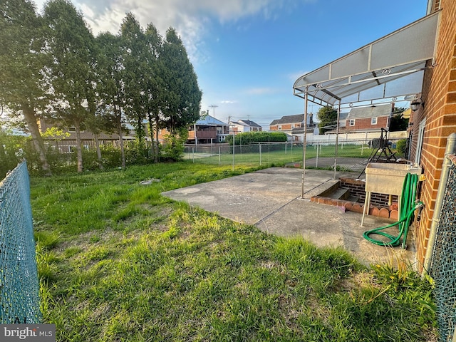 view of yard featuring a patio and a fenced backyard