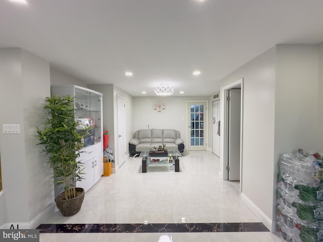 living room featuring recessed lighting and baseboards