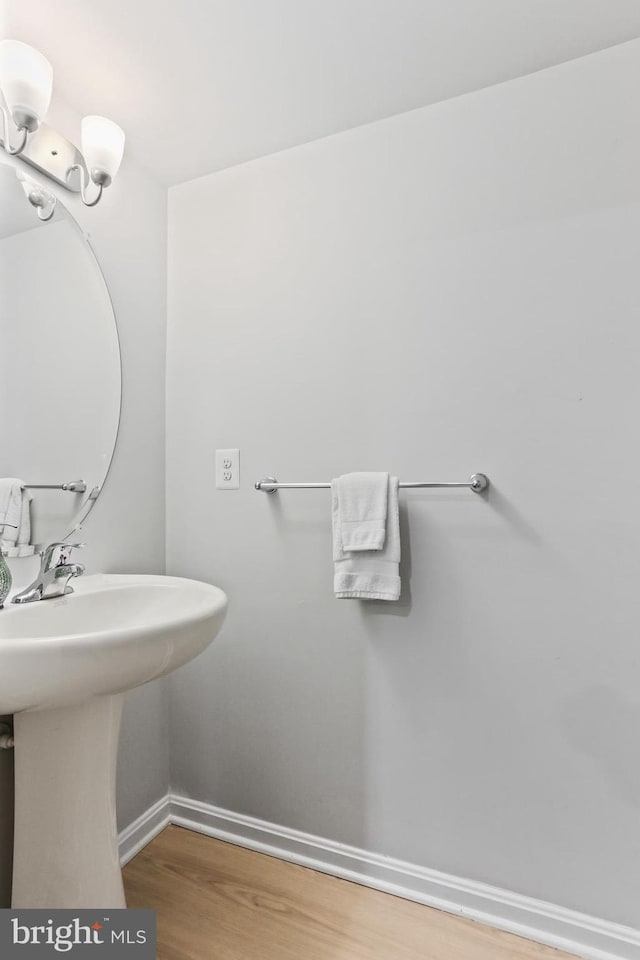 209 Sheridan St, Taneytown, MD 21787 - bathroom featuring baseboards and wood finished floors