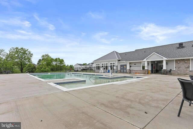 209 Sheridan St, Taneytown, MD 21787 - community pool with a patio area and a hot tub