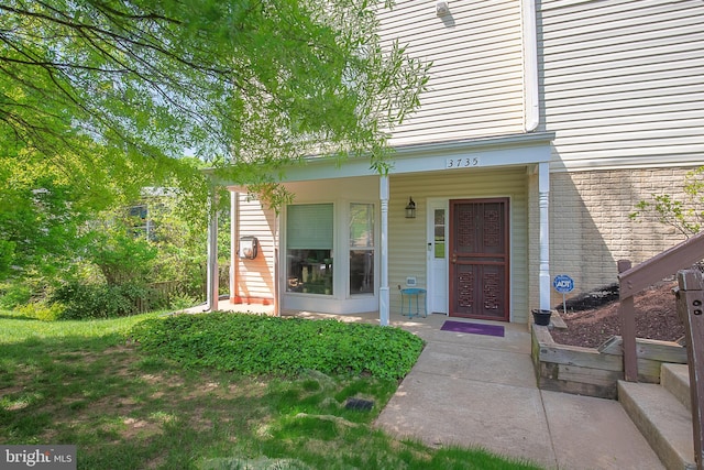 entrance to property with a porch